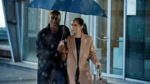 Widex Moment man and woman walking in rain under umbrella 1920x1080